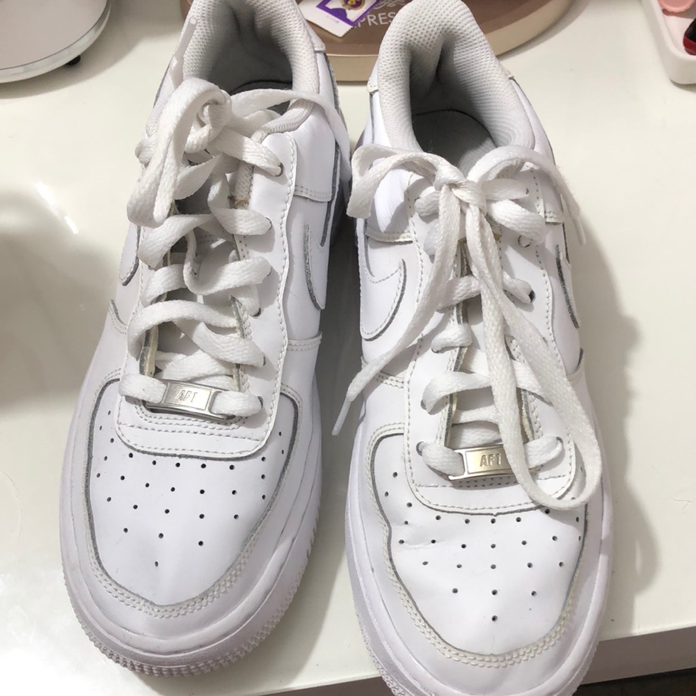 Youth air force 1 Nike sneakers fits an 8 in woman size